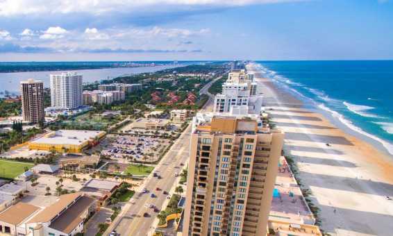 Aerial of hotels with river and ocean views